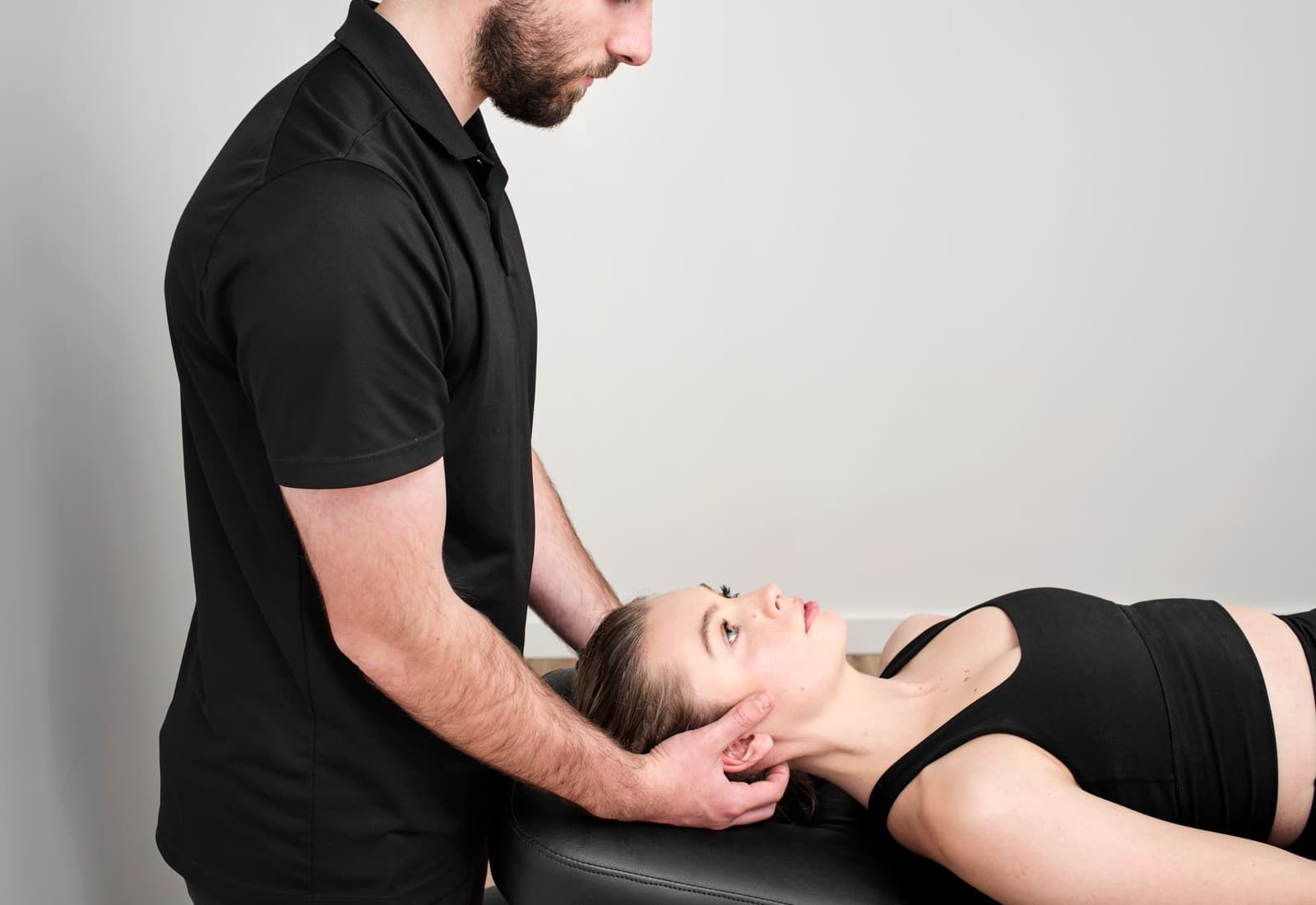 An osteopath at Matrix Health & Performance treating a patient's neck